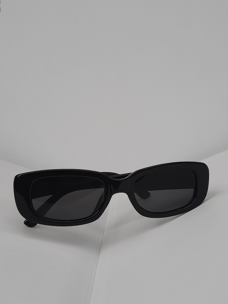 Black rectangular sunglasses on white.