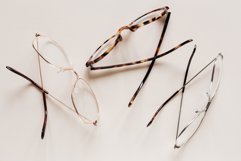 Three wire frames in gold, tortoise and silver.