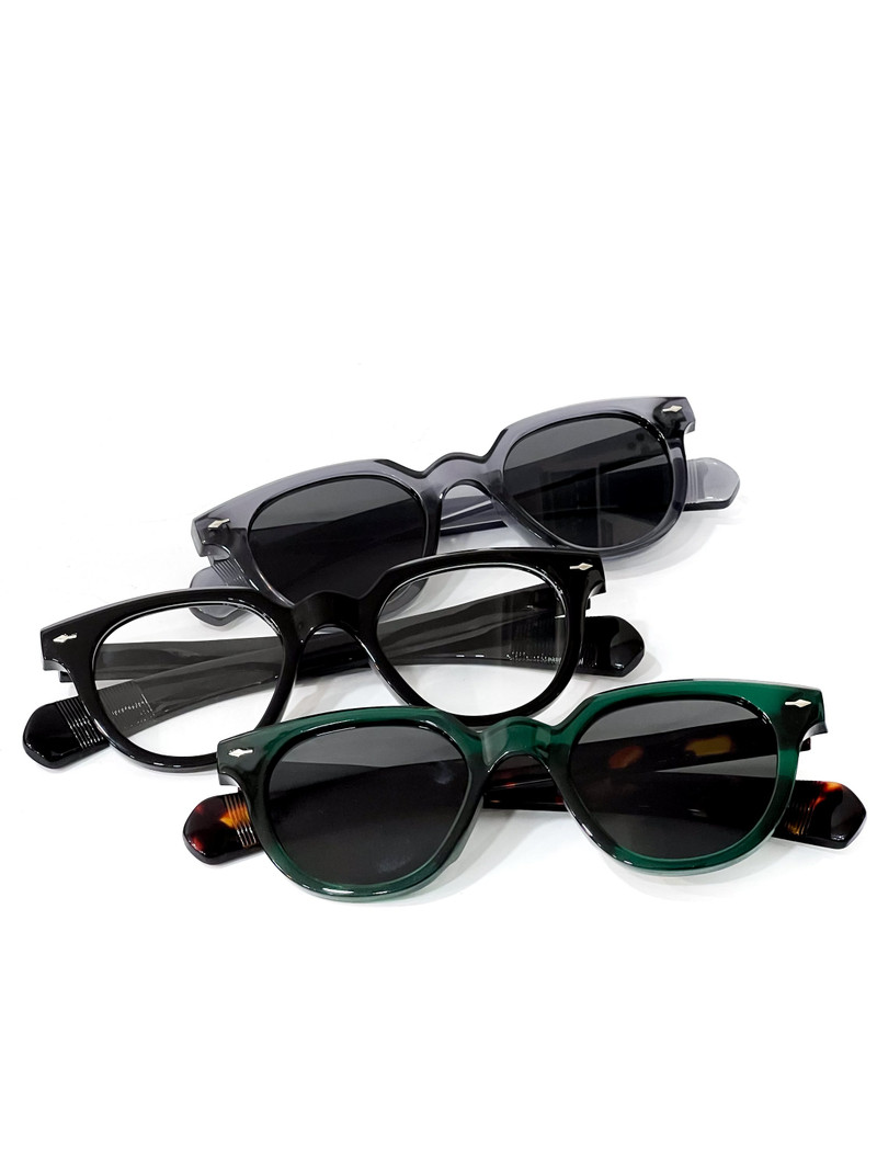 Keyhole sunglasses in grey, black and green.