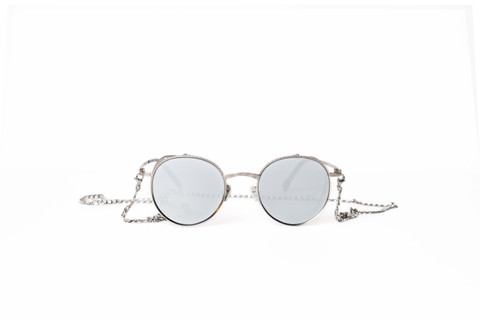 Round mirrored sunglasses on a fine chain.