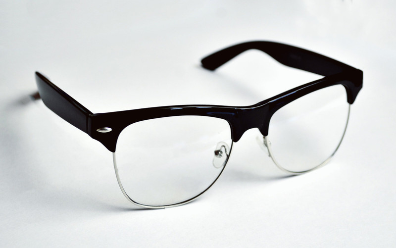 Browline frames with a dark top and a metal rim.
