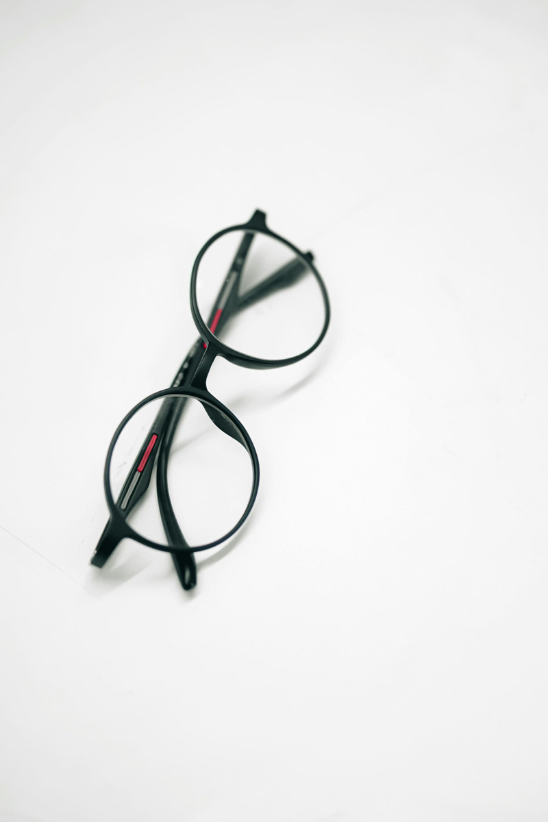 Round black flex frames on white.
