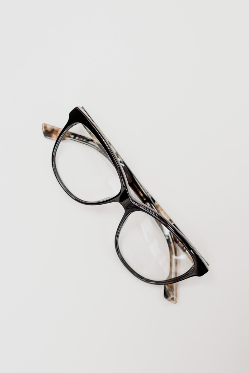 Tortoiseshell cat-eye frames on white.