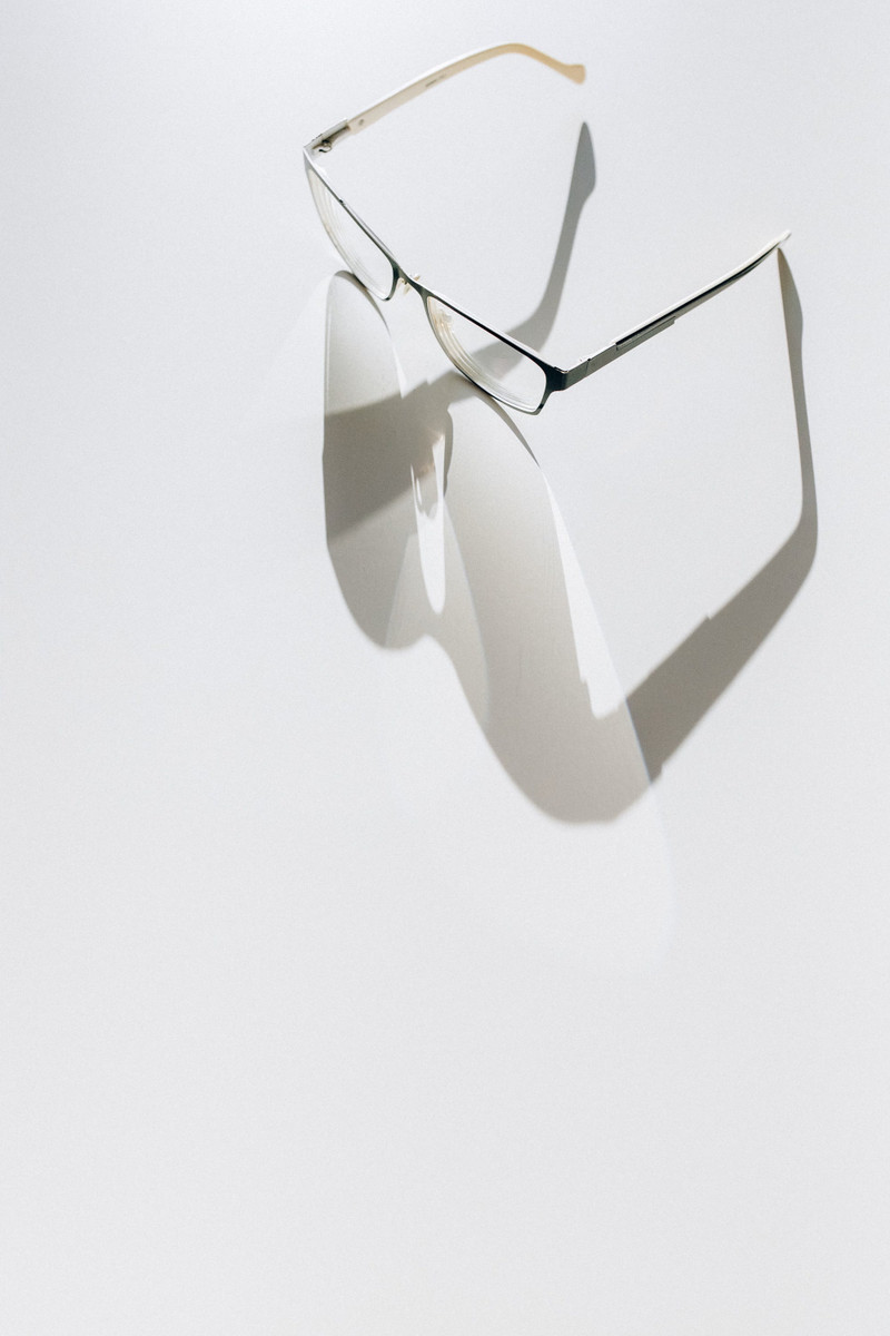 A fine metal frame floating over its shadow.